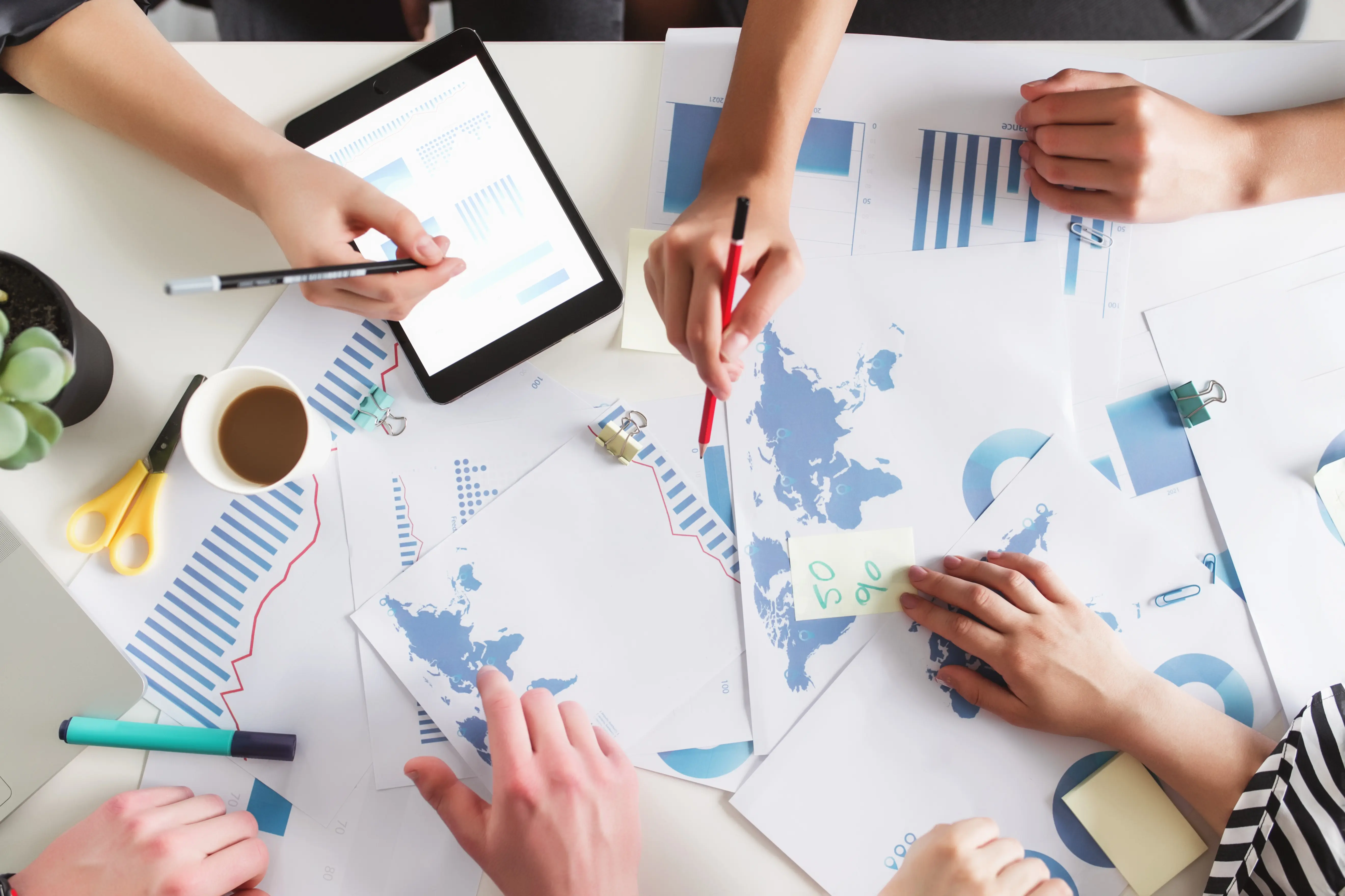 Positive entrepreneurs analyzing reports.