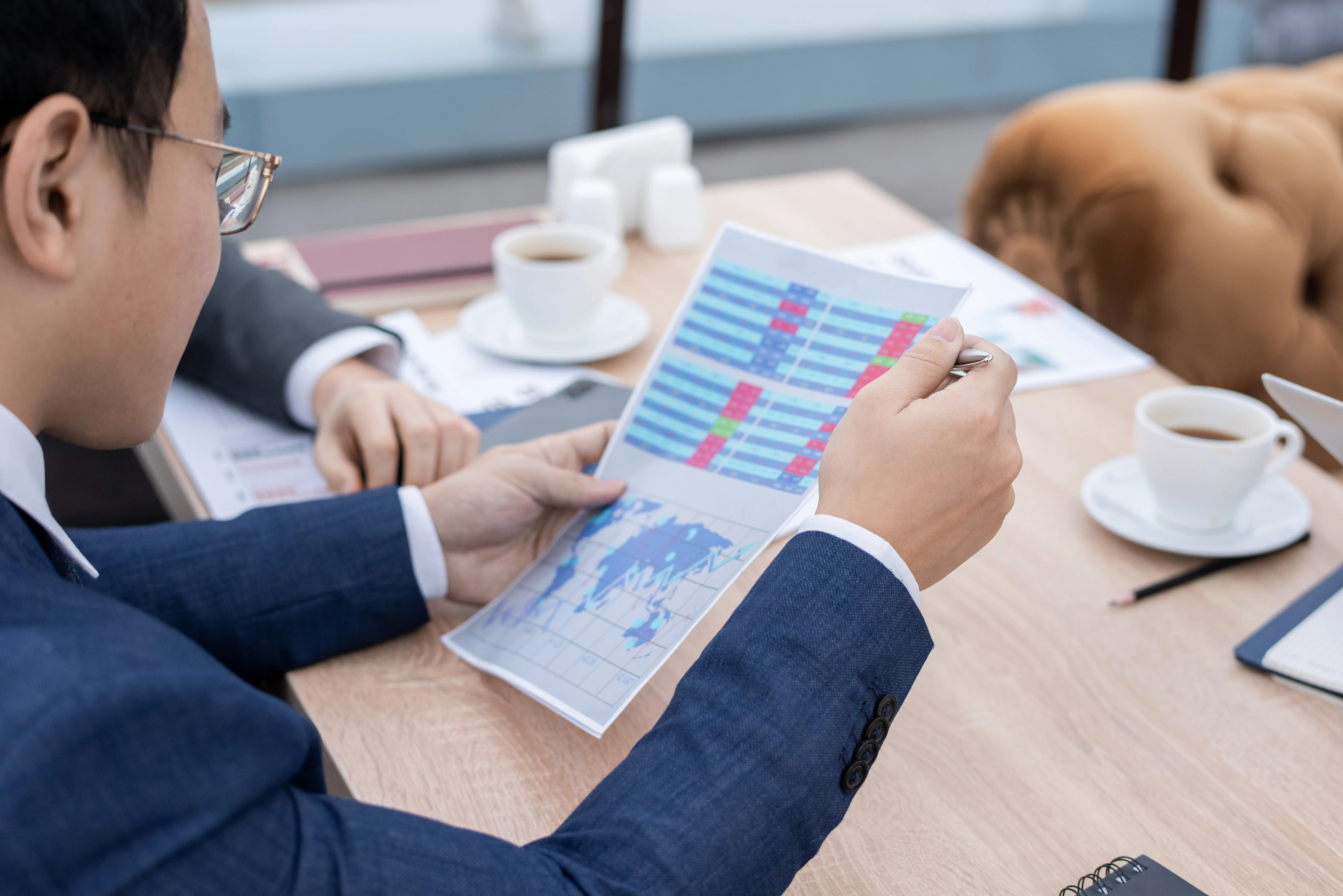 Positive entrepreneurs analyzing reports.