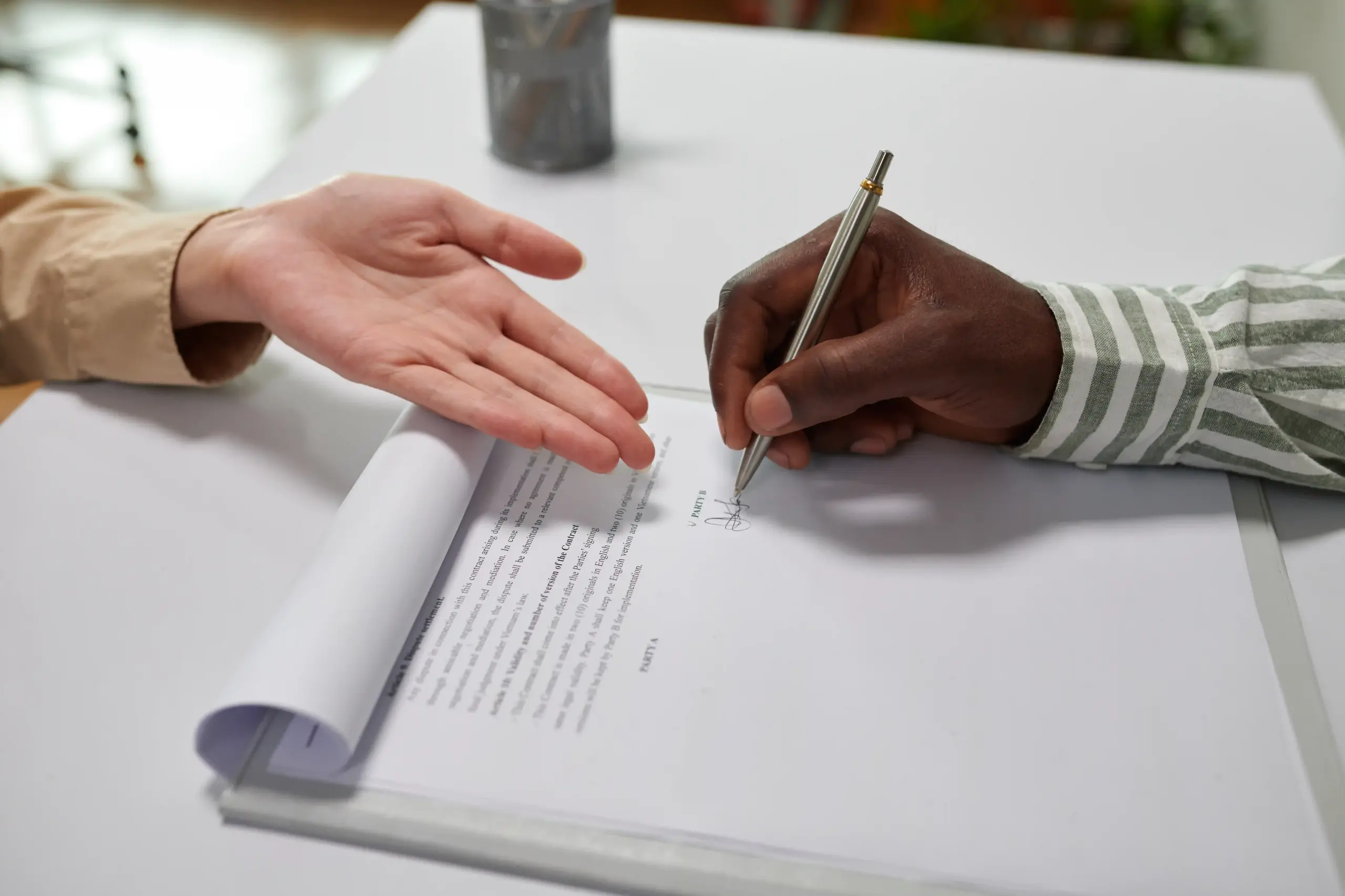 Image of a legal document being signed